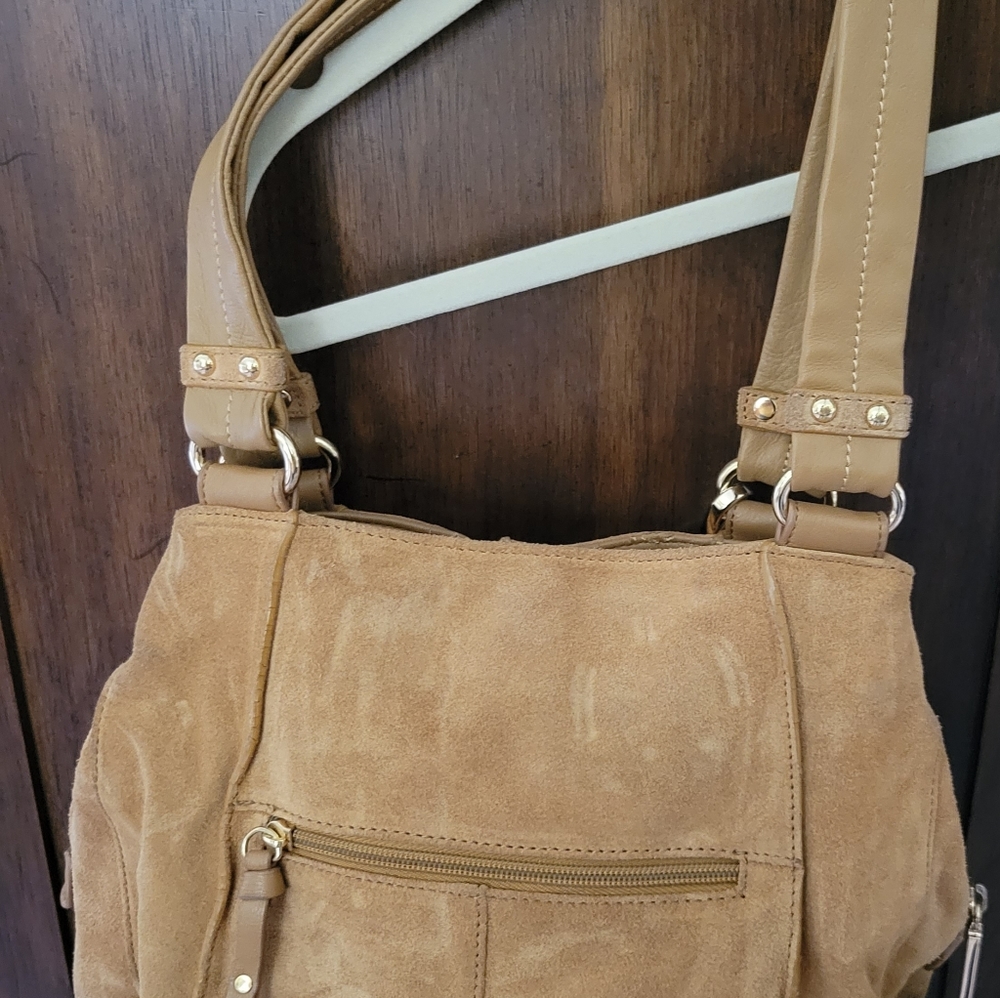 Purse in soft tan suede fabric. Wear over your shoulder.